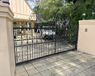 Wrought Steel Auto Gate scaled